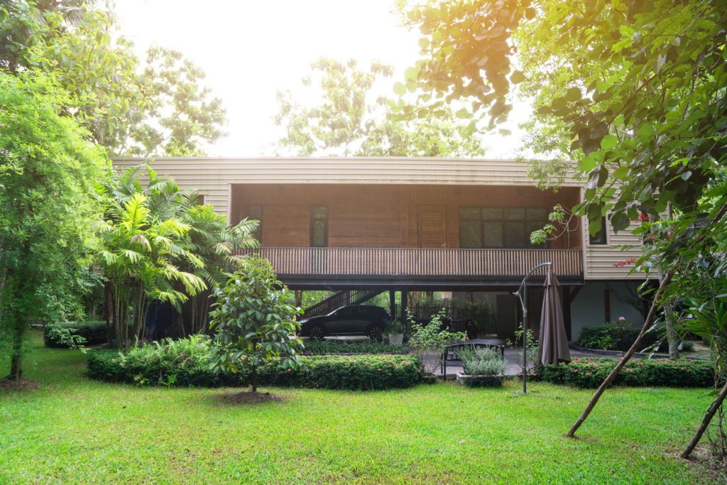 The wooden façade covering makes the industrial container look disappear. 